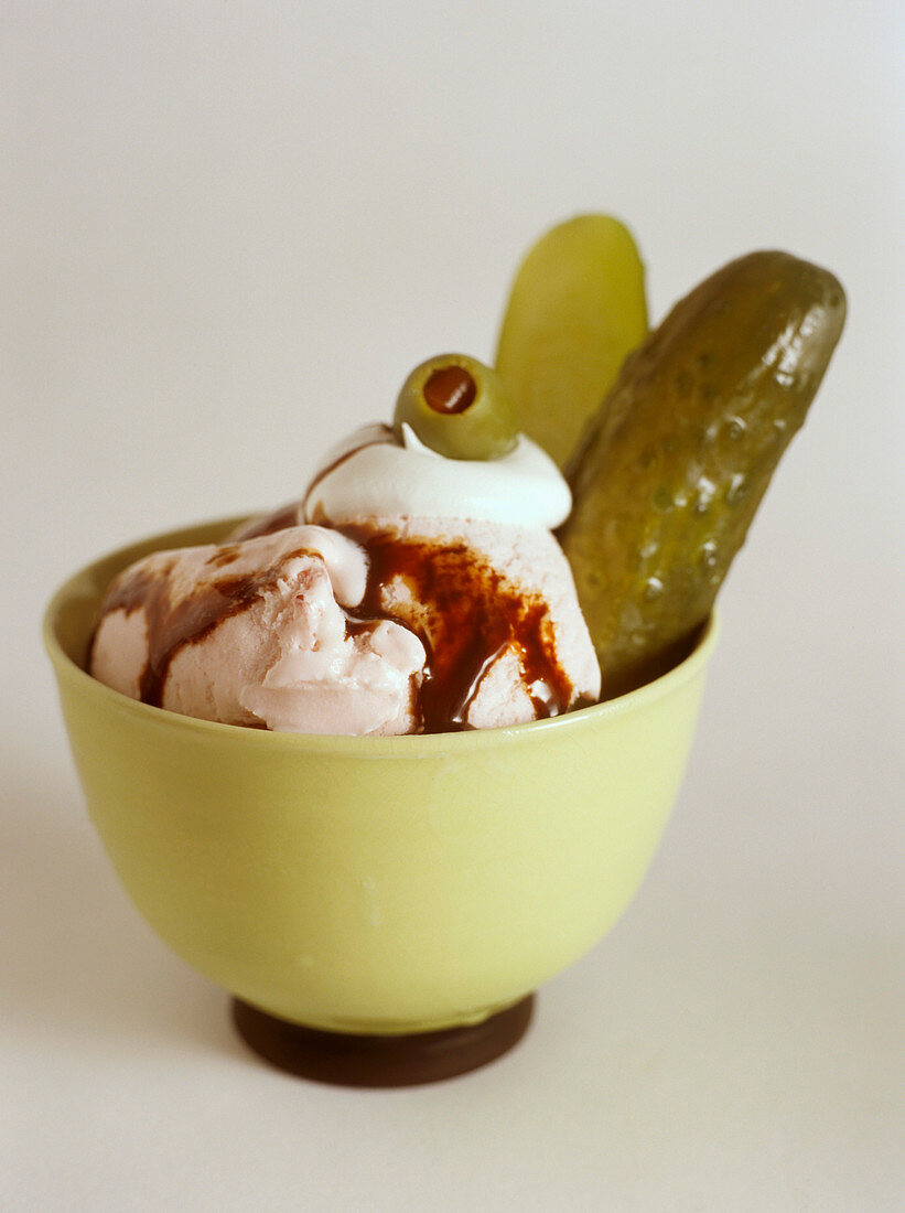 Bowl of Vanilla Ice Cream with Hot Fudge, Whipped Cream, Pickles and Olives