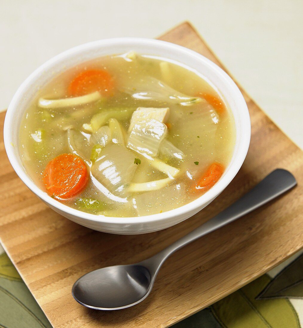 Bowl of Chicken Noodle Soup with Spoon