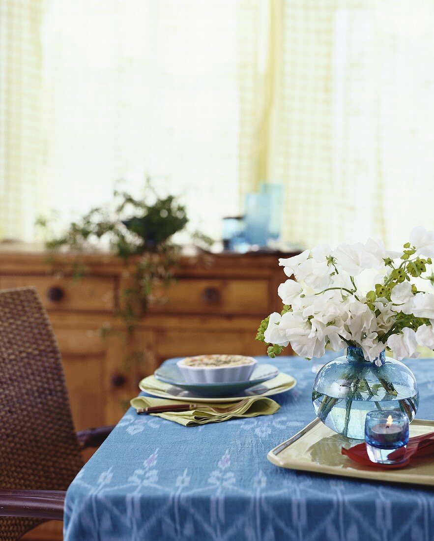 Mini-quiche on table laid in blue