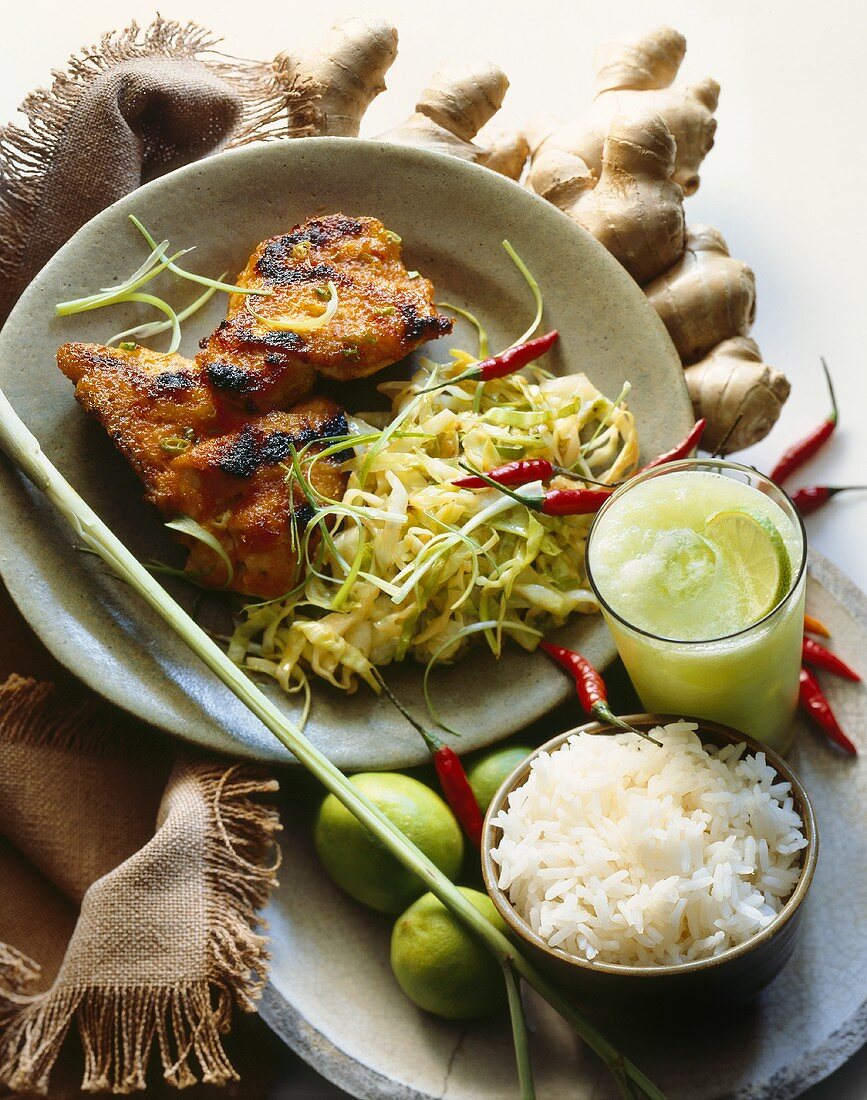 Spicy Asian Chicken Served with Slaw and a Bowl of White Rice