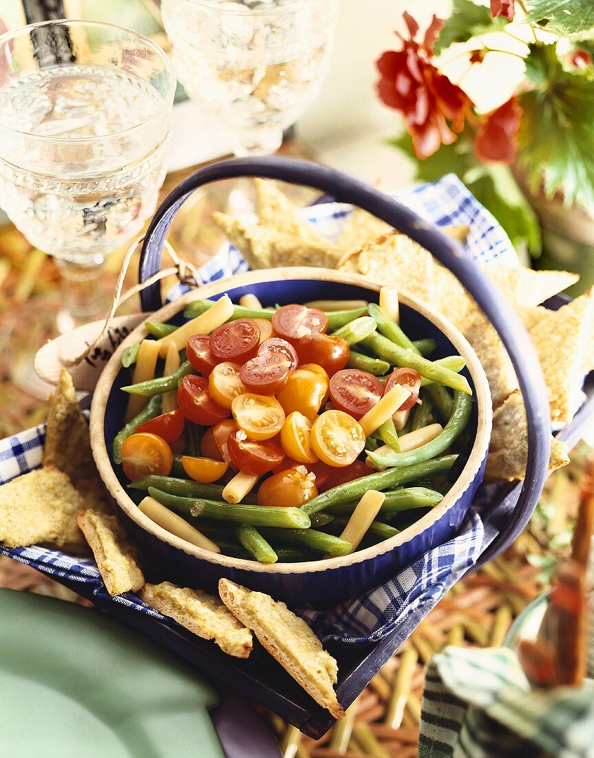 Bowl of Red and Yellow Tomatoes with Green and Yellow Bean Salad; Bread Triangles