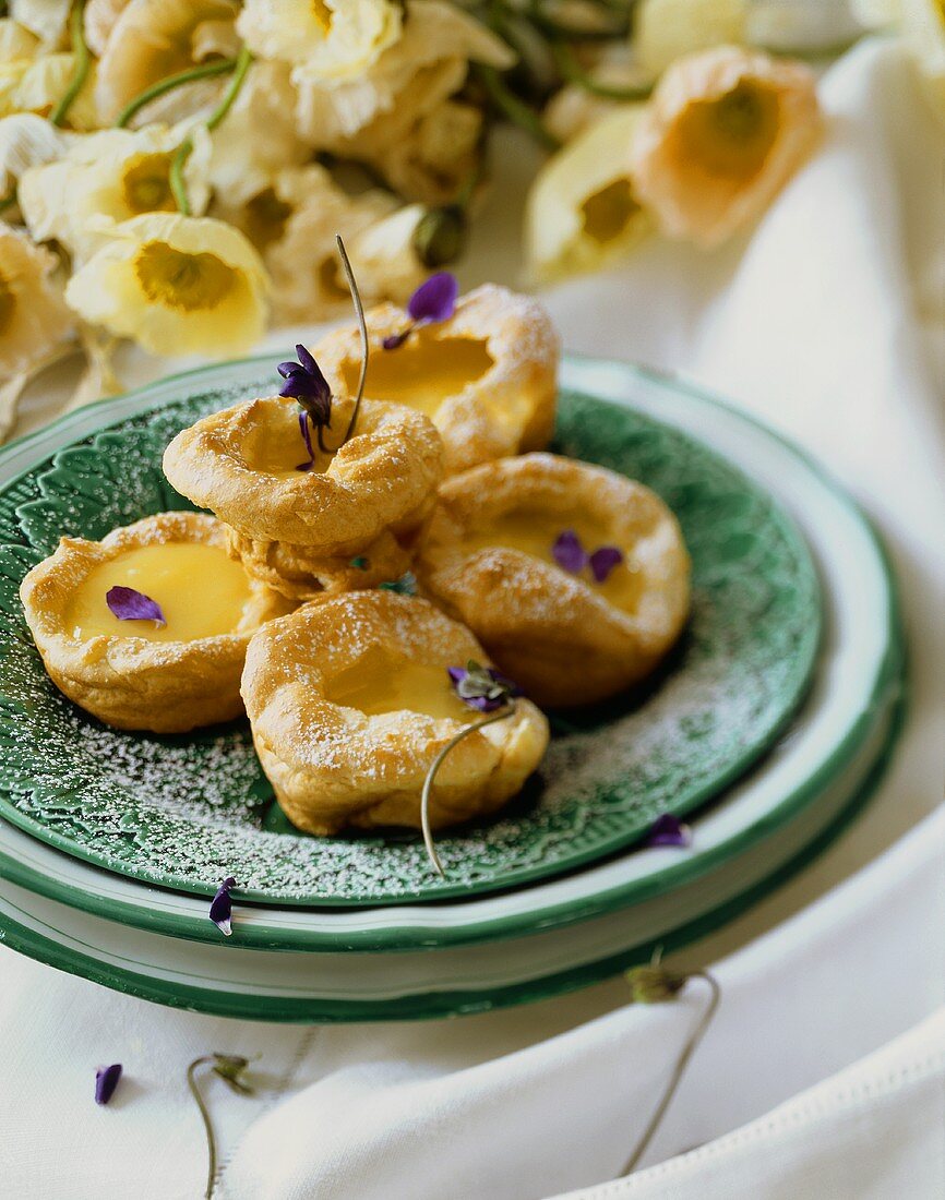 Lemon Tartlets on a Plate Sprinkled with Powdered Sugar