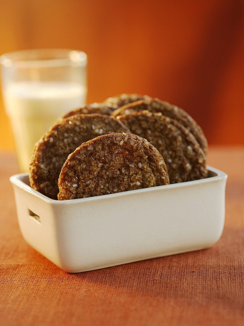 Chocolate Sugar Cookies in a White Square Bowl; Glass of Milk