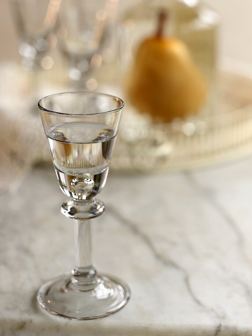 Pear Brandy in Shot Glass; Tray with Glasses, Decanter, and Pear