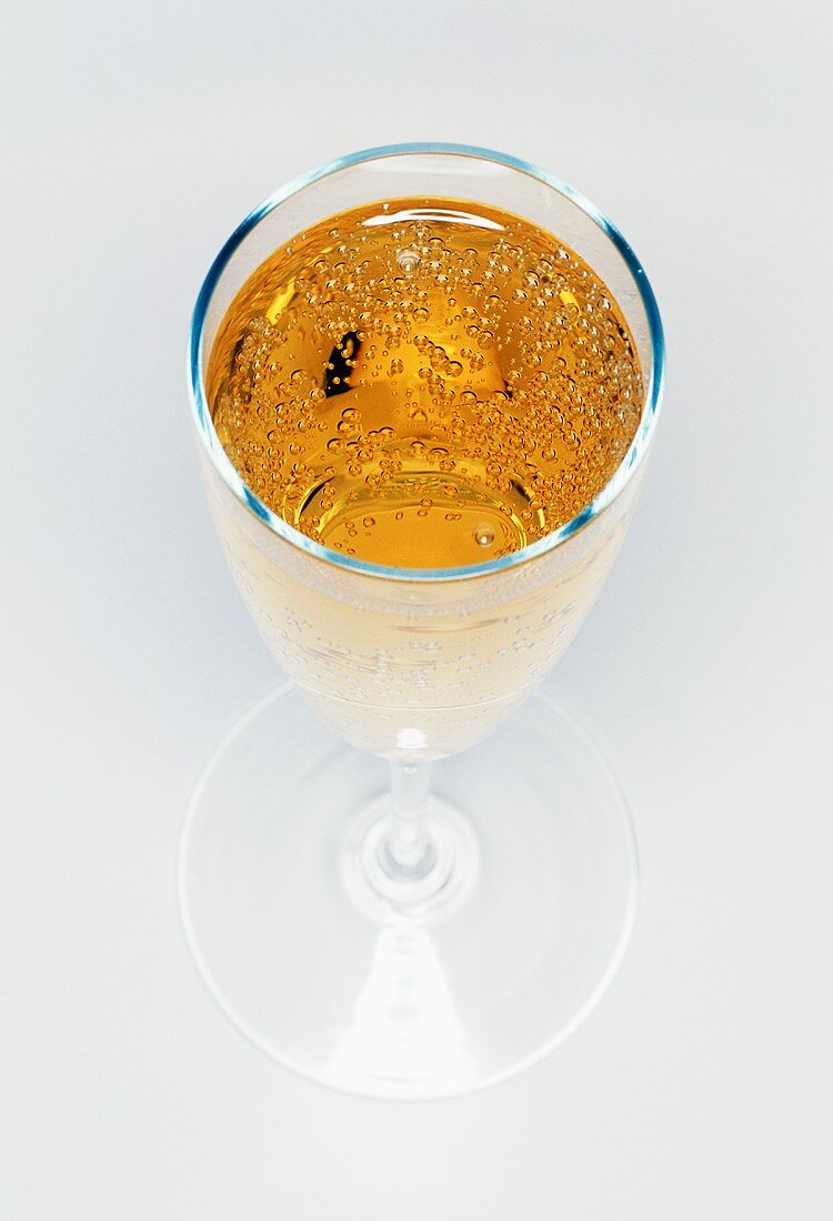 Glass of sparkling wine from above