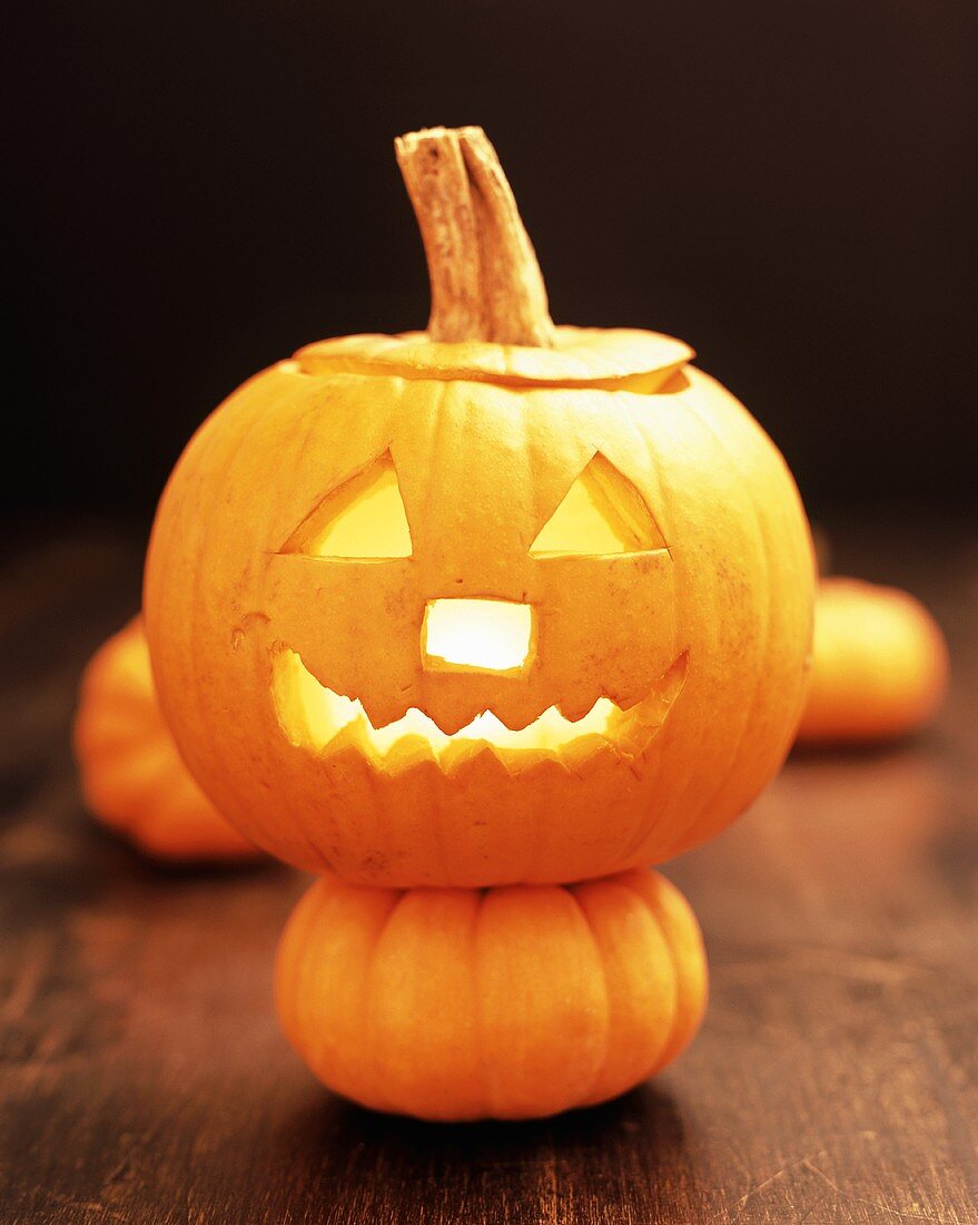 Pumpkin lantern on small pumpkin for Halloween