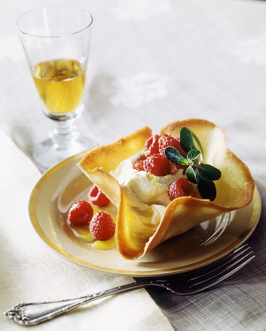 Vanilla mousse with raspberries in wafer bowl