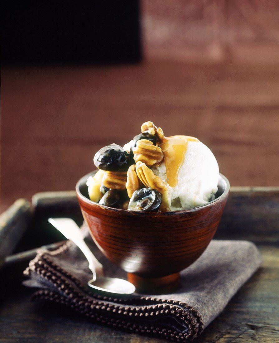 Vanilla ice cream with pecans, dates and caramel sauce