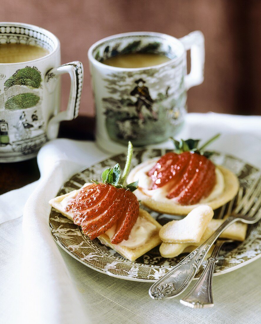 Shortbread with soft cheese and strawberries, with tea