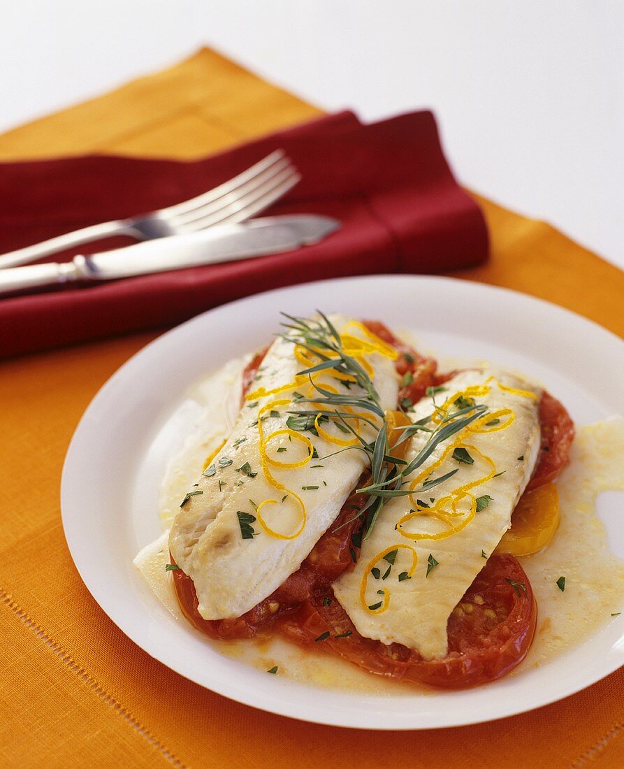 Sea bass fillet with tarragon on tomato slices