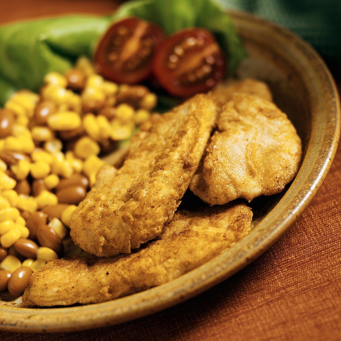 Fried Chicken with Taco Seasoned Bread Crumbs Served with Corn and Beans