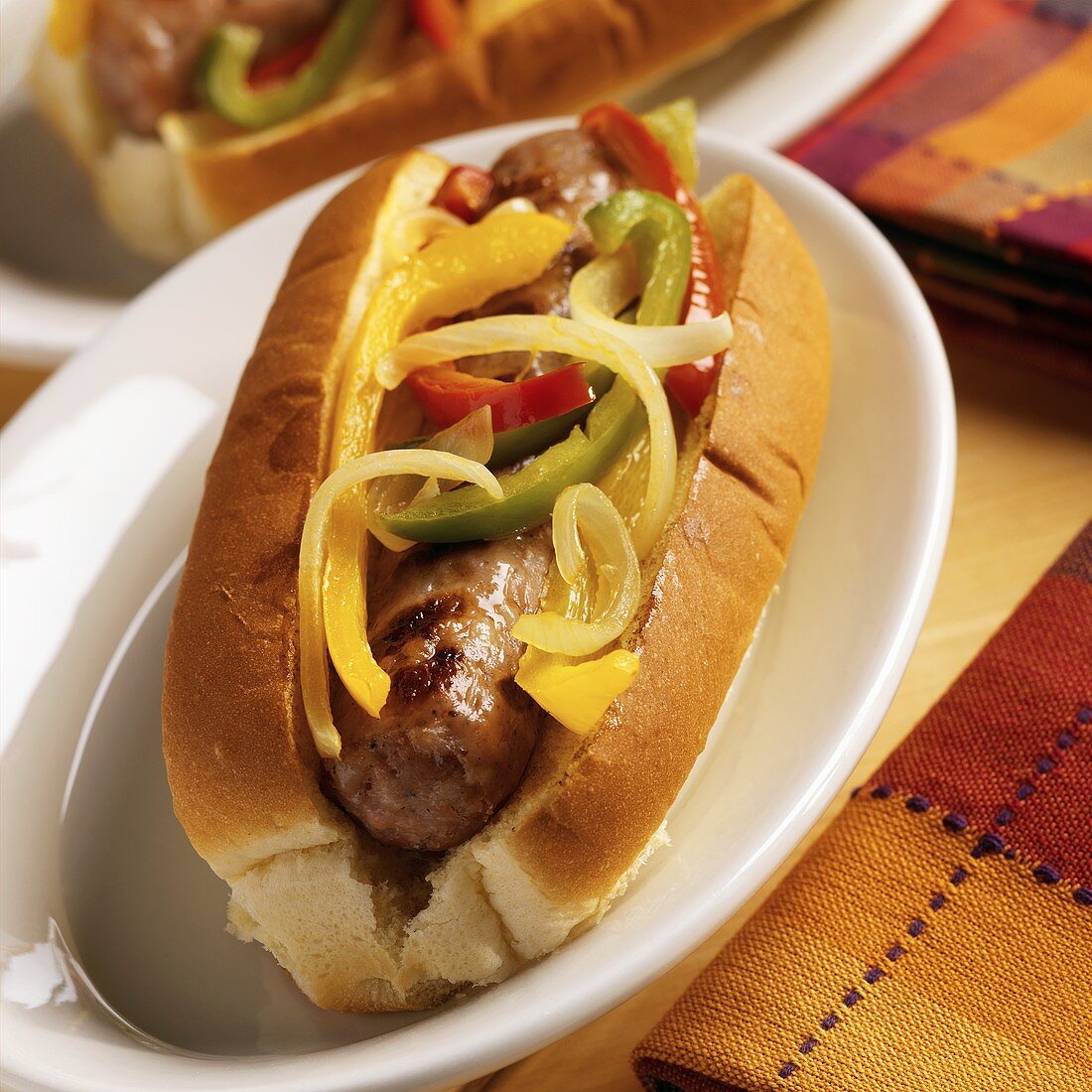 Sausage, peppers and onions in a hot dog … – License Images – 654596 ...