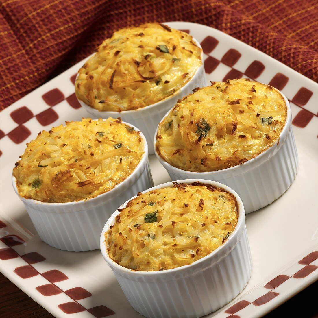 Four Potato Cheese and Green Onion Casseroles in Ramekins