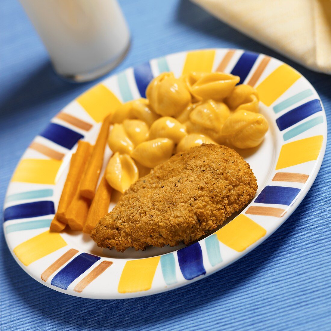 Breaded Chicken Tender with Creamy Macaroni and Cheese Shells and Carrot Sticks