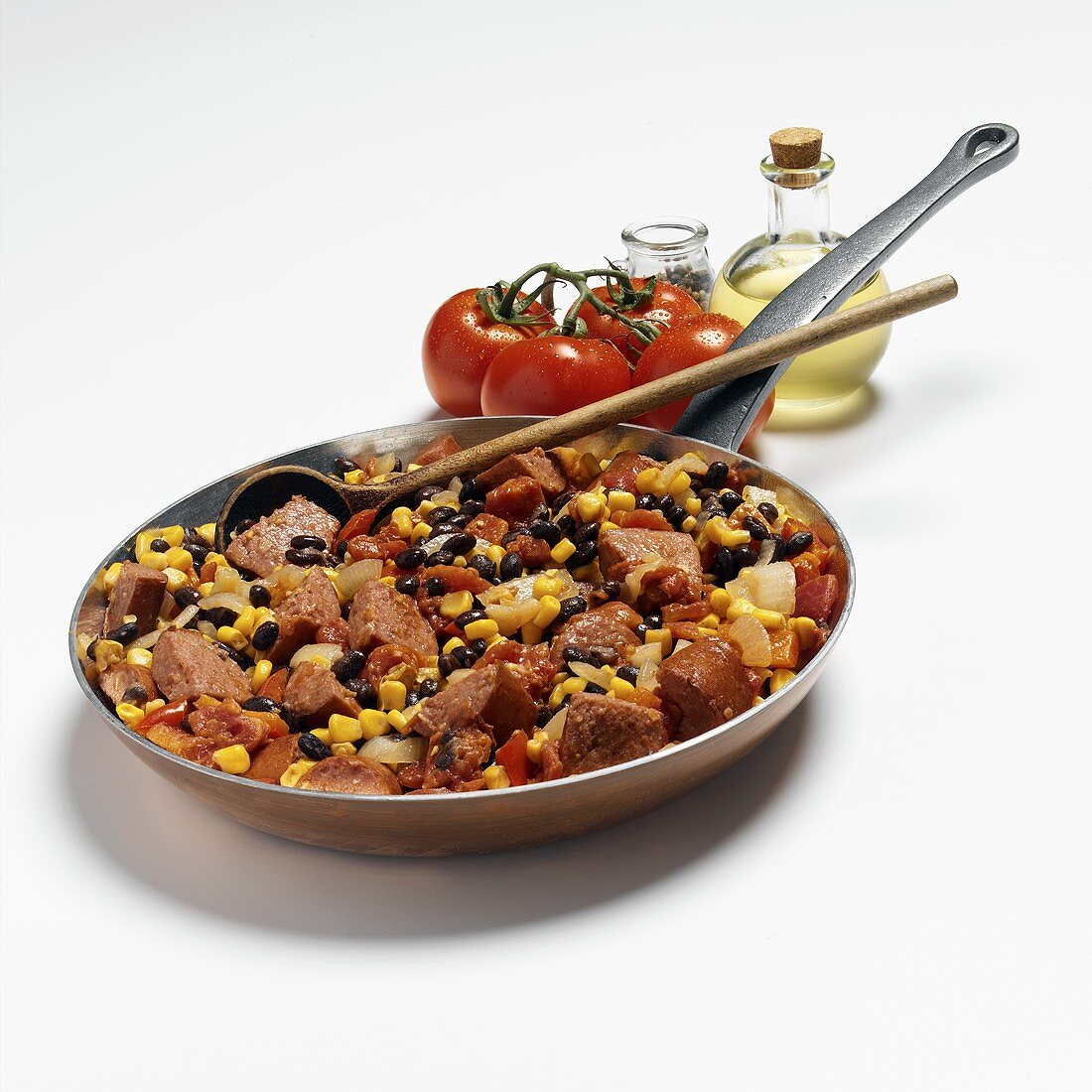 Sausage with beans and sweetcorn in a frying pan
