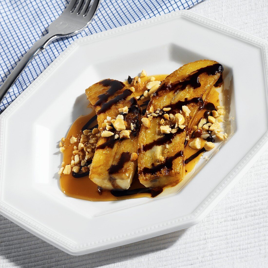Fried banana with caramel, chocolate sauce and nuts