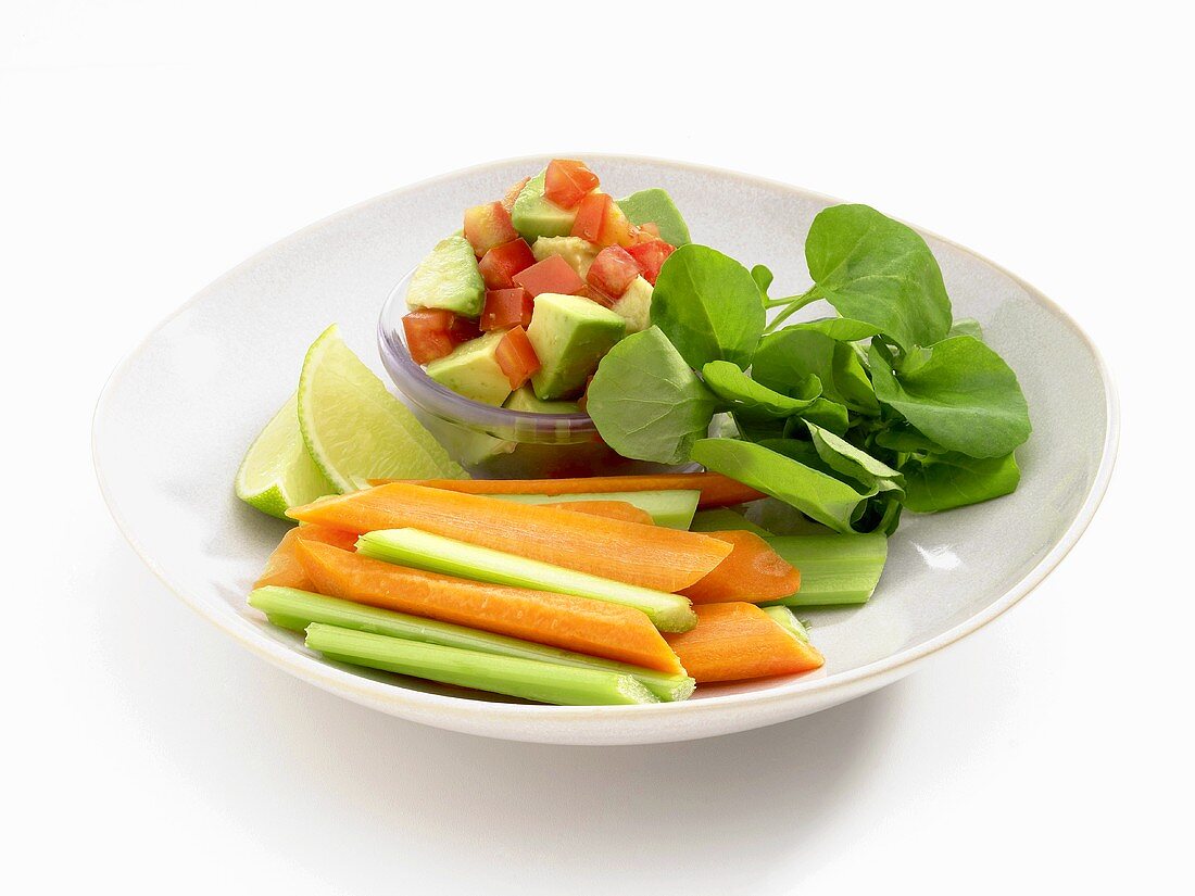 Avocado and tomato salad, carrot and celery sticks