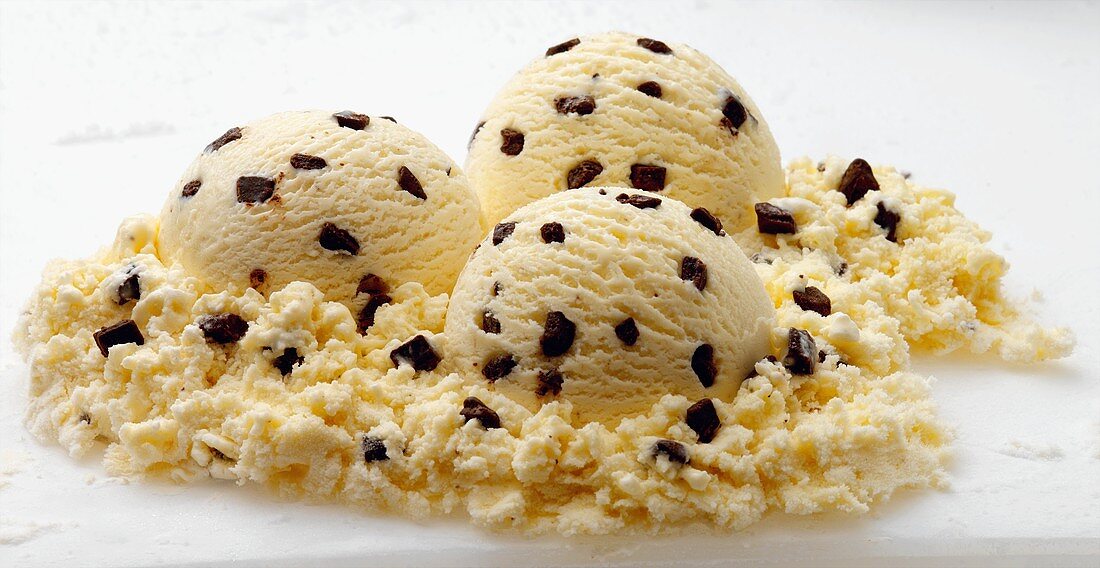 Three Scoops of Chocolate Chip Ice Cream on White Background