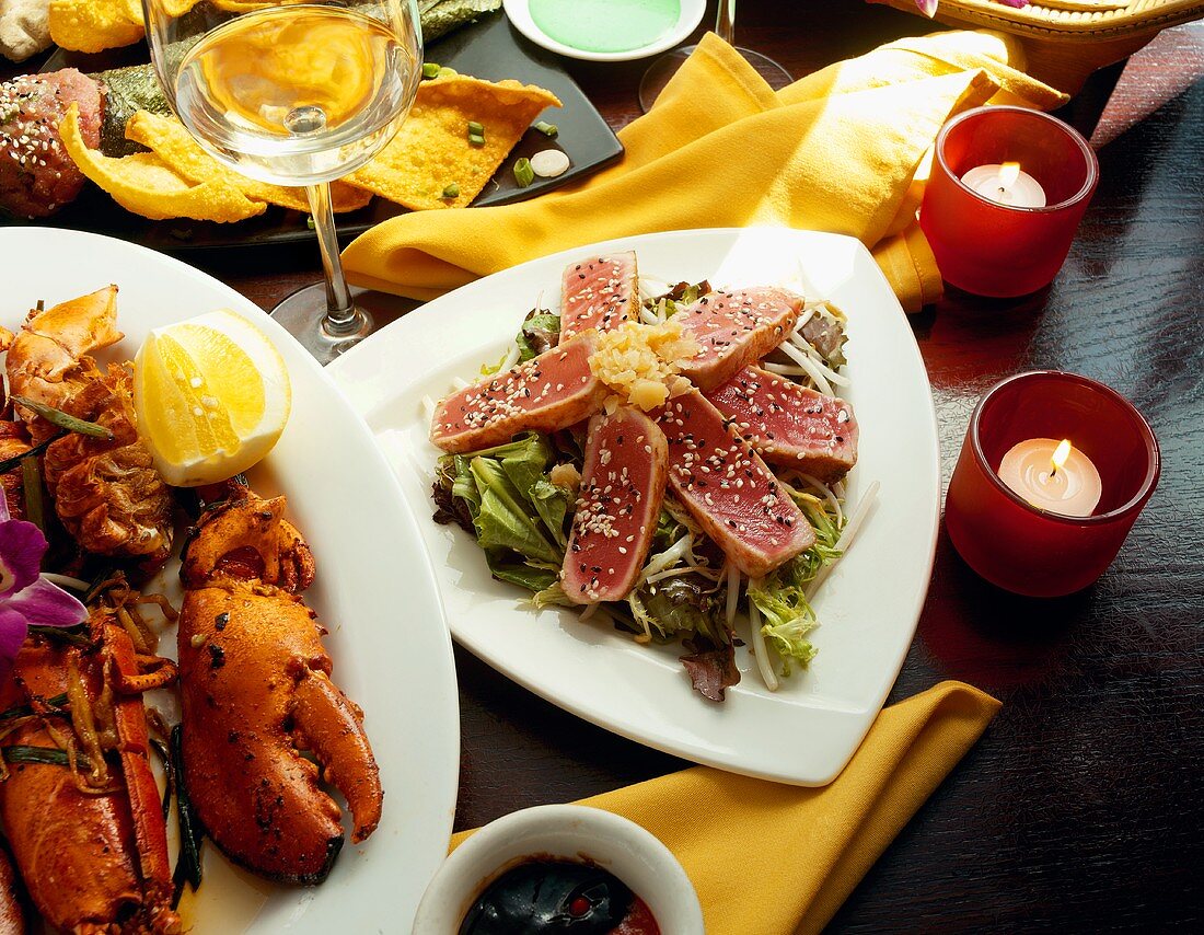 Assorted Seafood Dishes, Sliced Tuna on Bed of Greens, Platter of Lobster