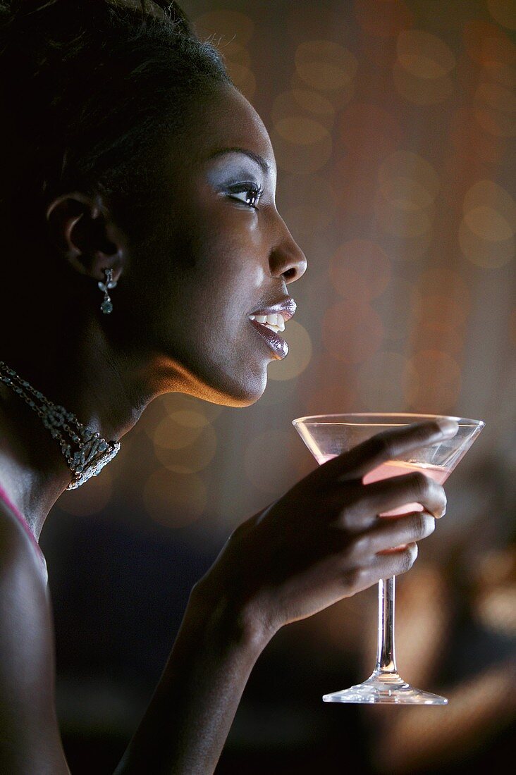 Profile of Woman in Nightclub Holding Martini
