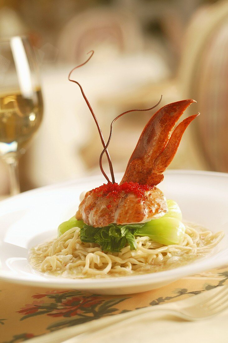 Elegant Lobster Entree with Roe and Baby Bok Choy on Bed of Pasta