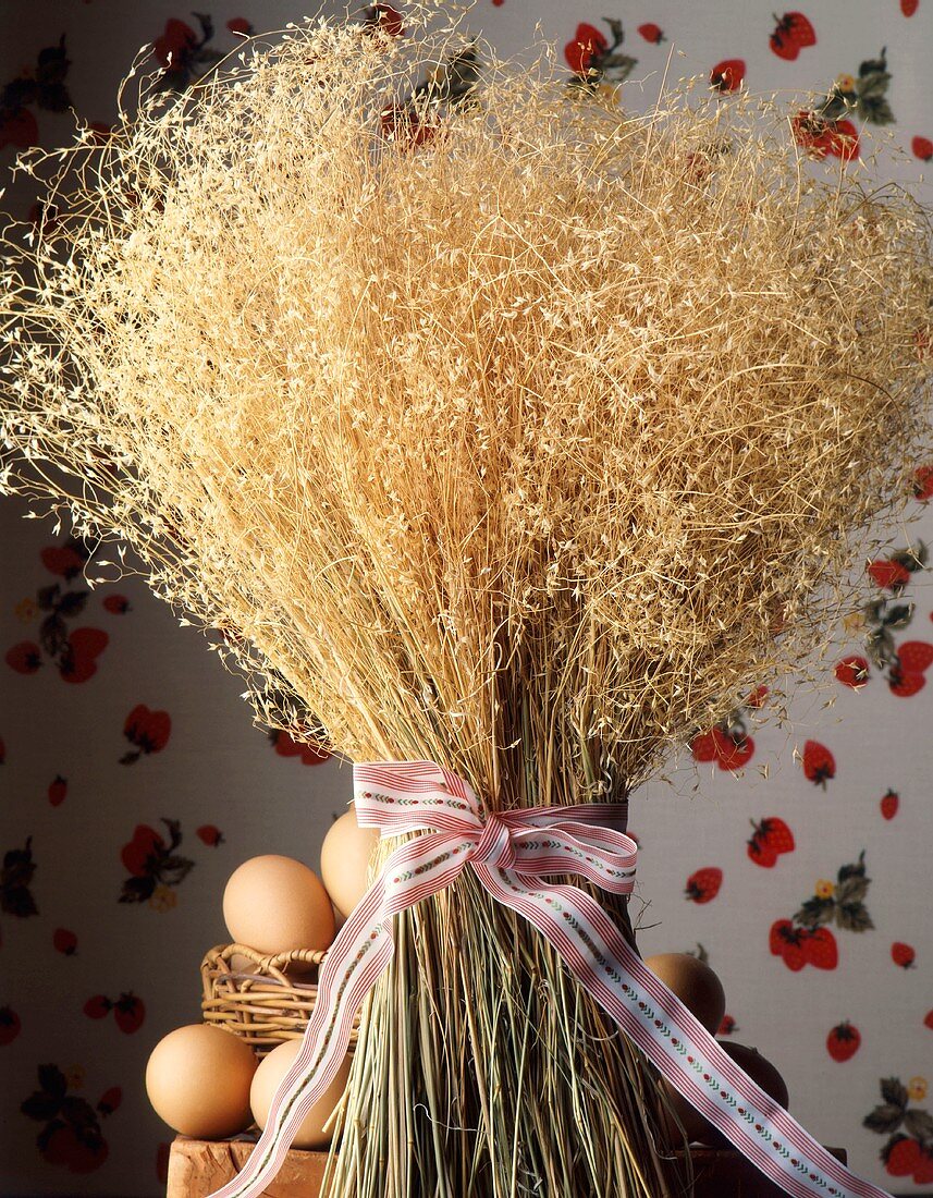 A bouquet of wheat ears and fresh eggs