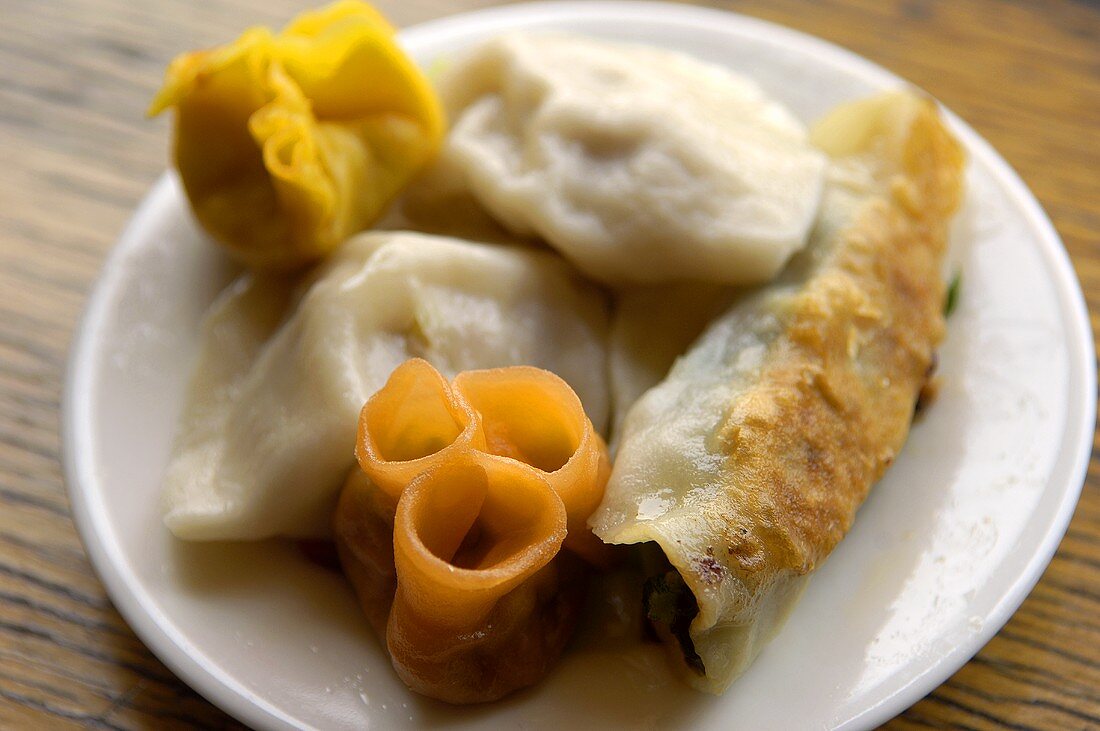 An assortment of dumplings on a plate (Asia)