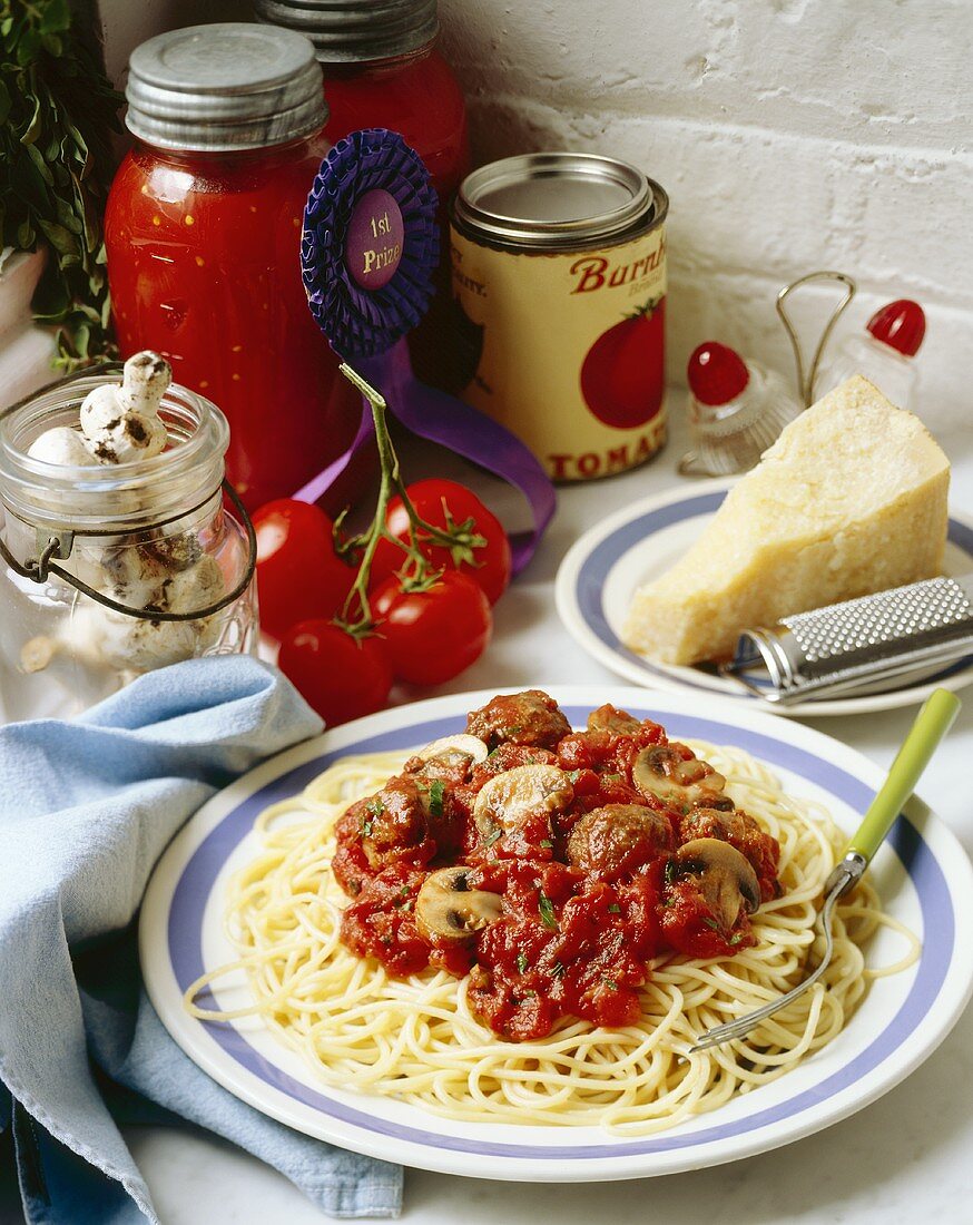 Plate of Spaghetti and Meatballs with Mushrooms; Jar of Tomato Sauce with Blue Ribbon