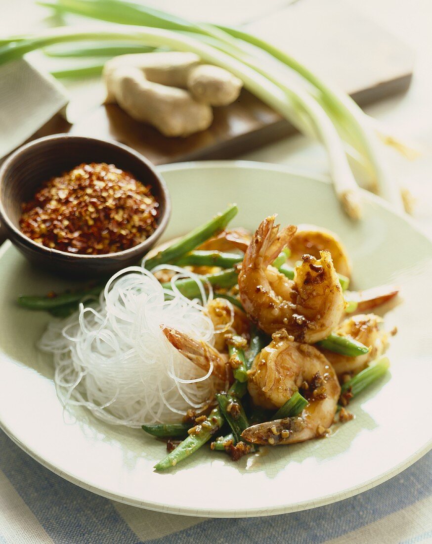 Shrimp with Green Beans and Rice Noodles; Bowl of Chili Flakes