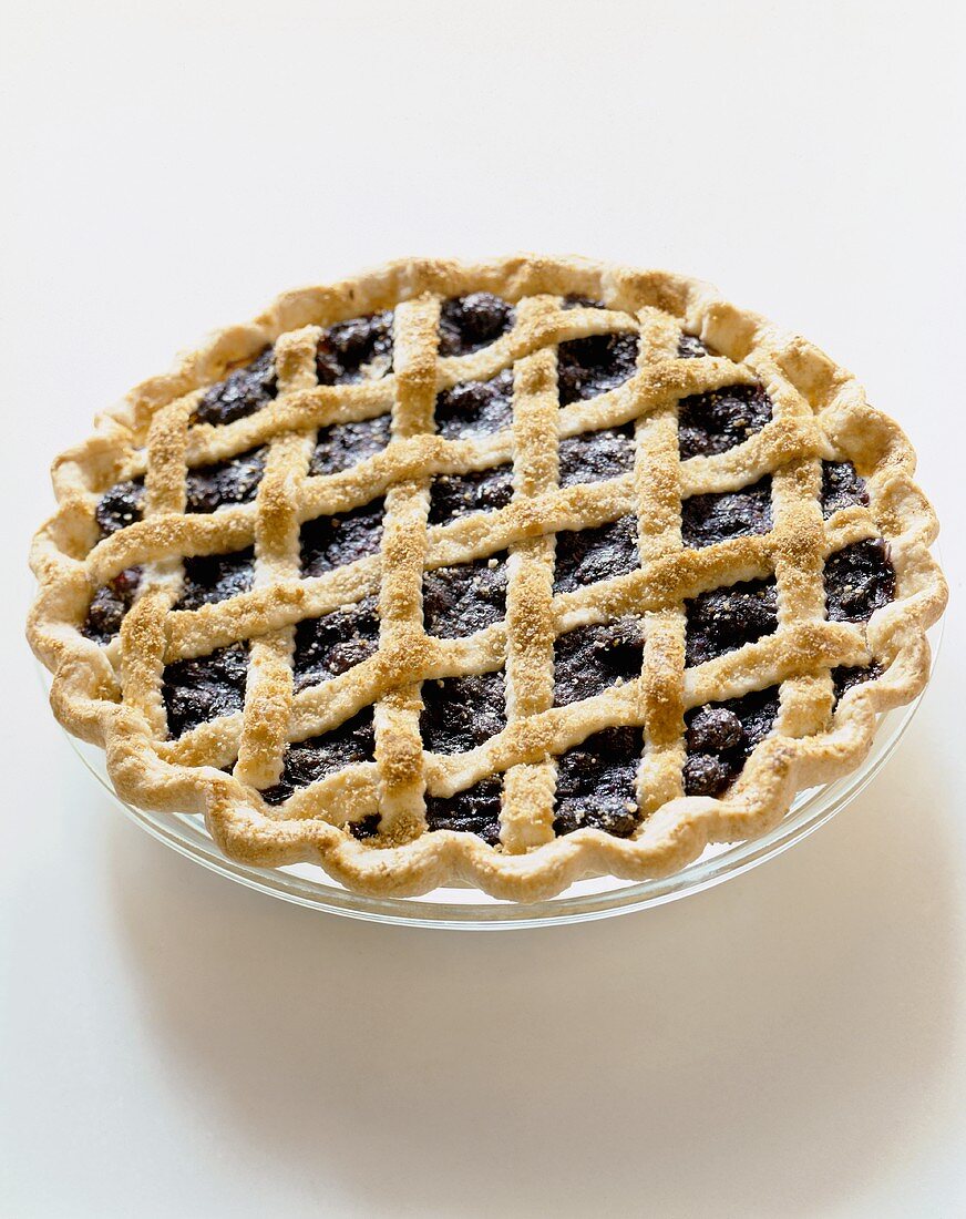 Blueberry Pie with Lattice Crust on a White Background
