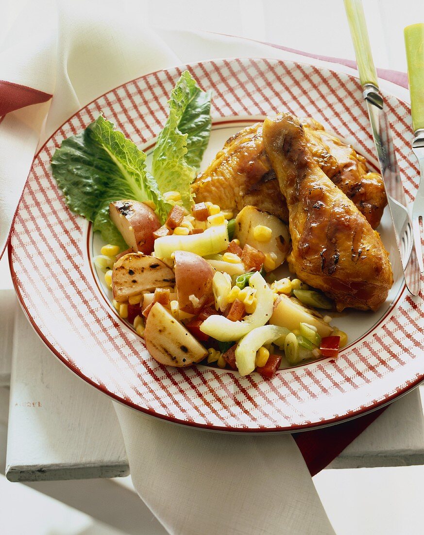 Grilled Chicken with Grilled Potato and Cucumber Salad on a Plate