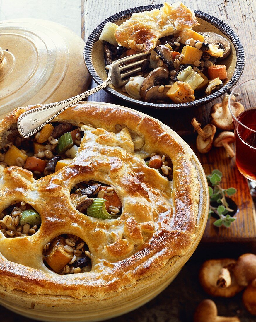 Vegetable Barley Pot Pie in Baking Dish with a Serving in a Bowl