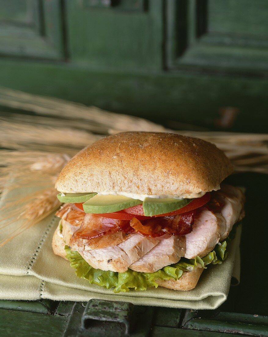 Sliced Pork Sandwich with Bacon and Avocado