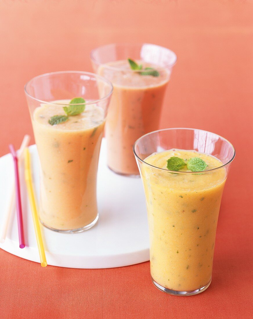 Fruit Smoothies with Mint Garnish; Straws