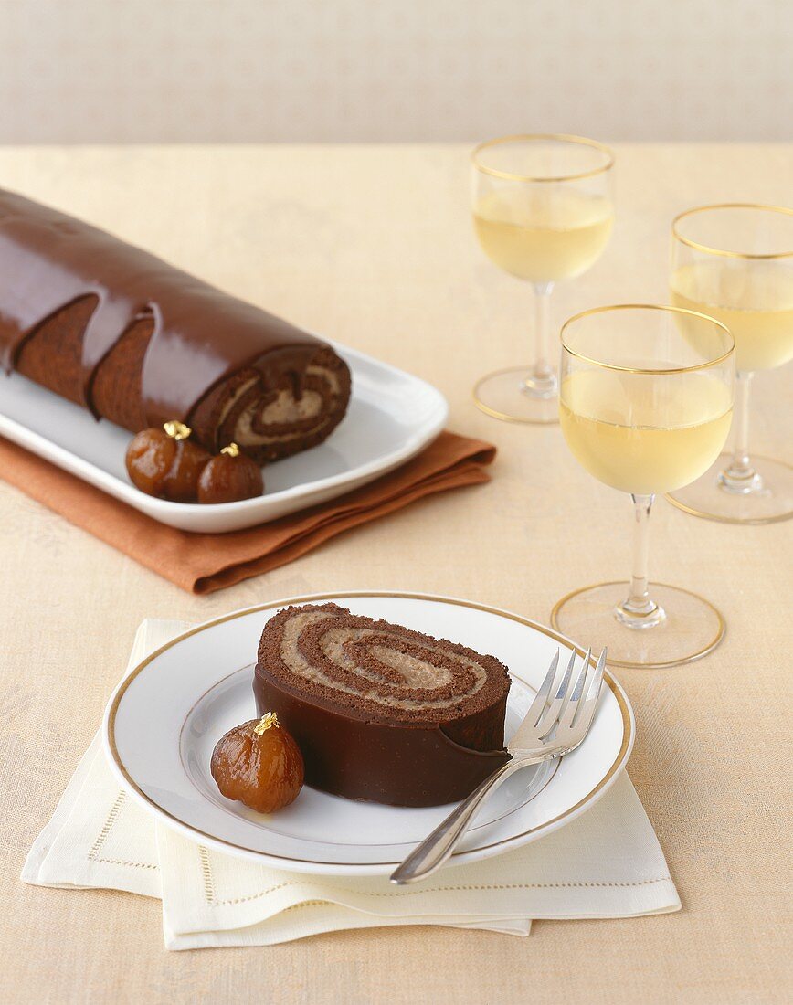 Slice of Chocolate Roulade; Glasses of White Wine
