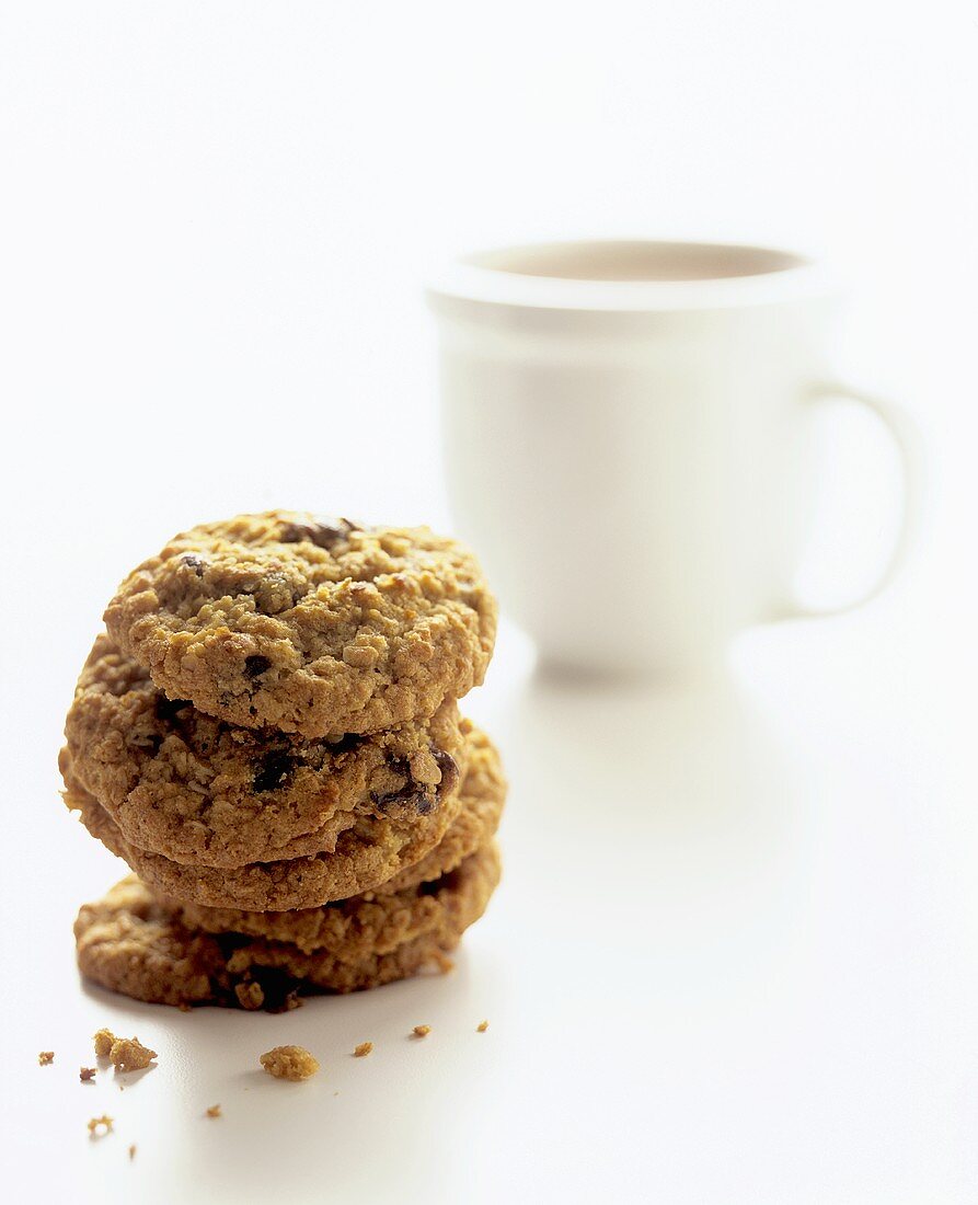 Stack of Oatmeal Raisin Cookies; Cup of Hot Chocolate 