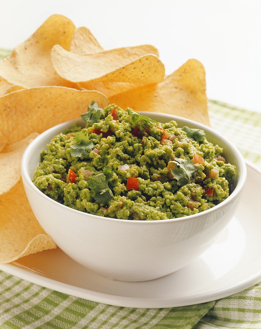 Bowl of Green Pea Salsa with Chips