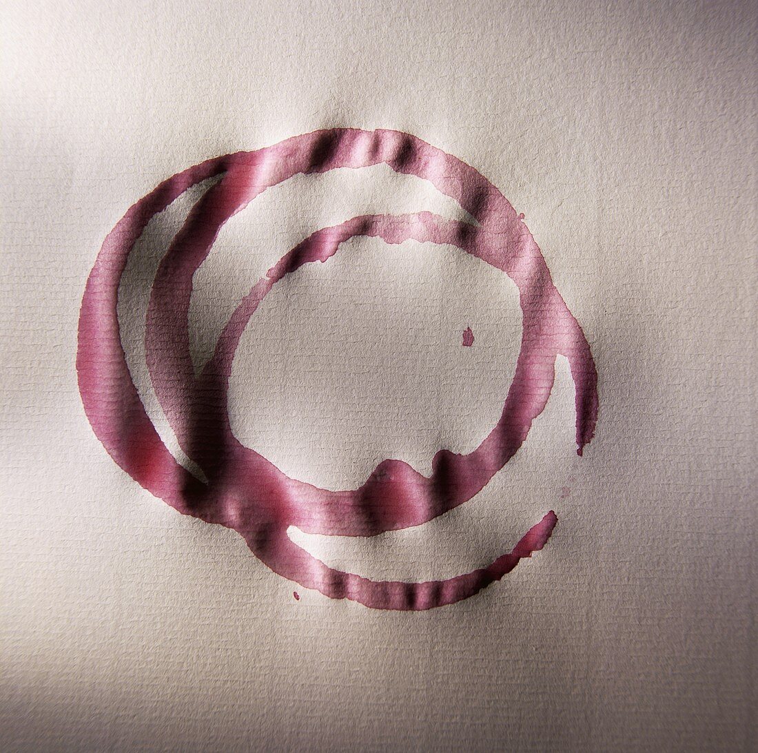 Red Wine Rings on a White Table Cloth