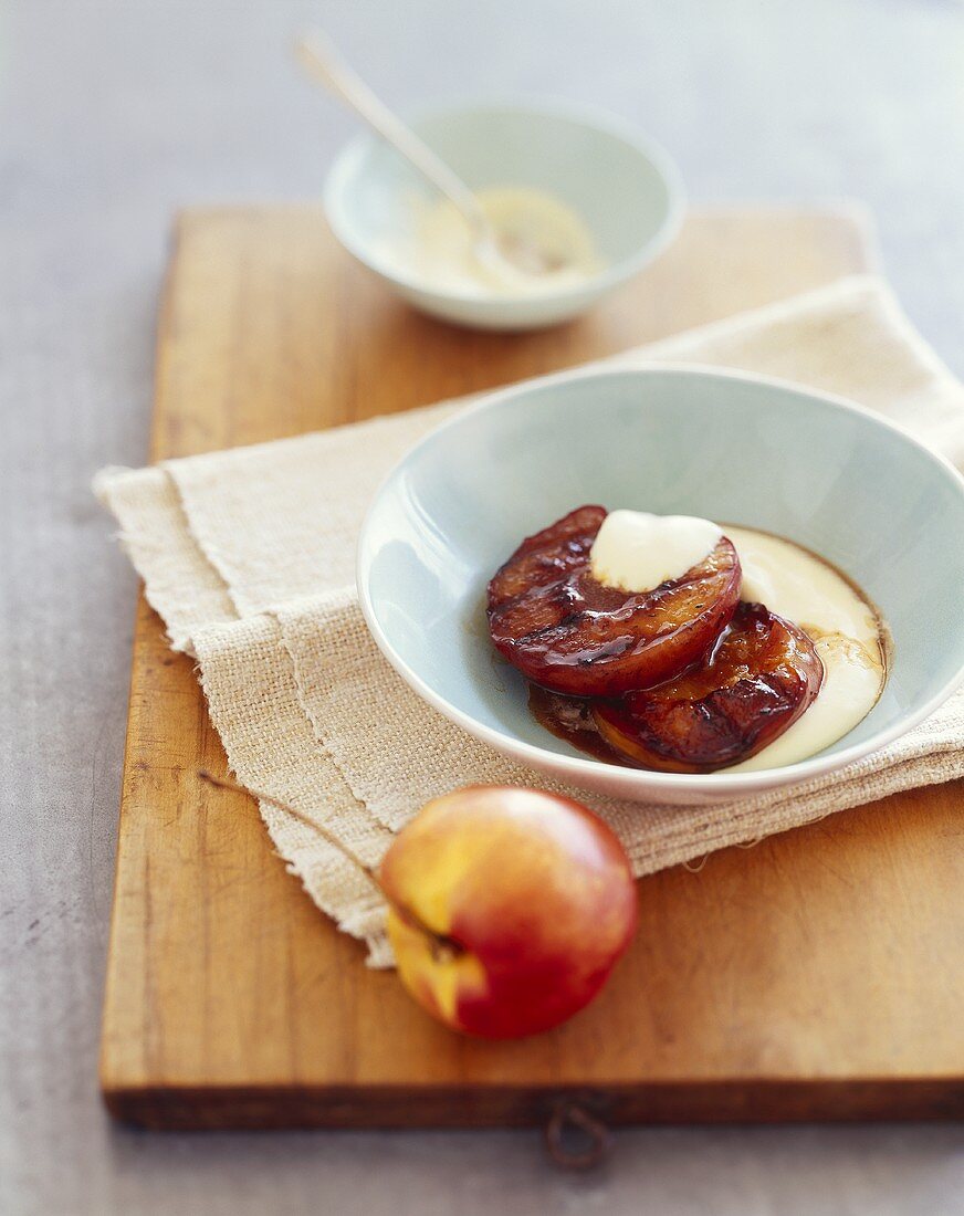 Grilled Peaches with Creme Anglaise in a Bowl