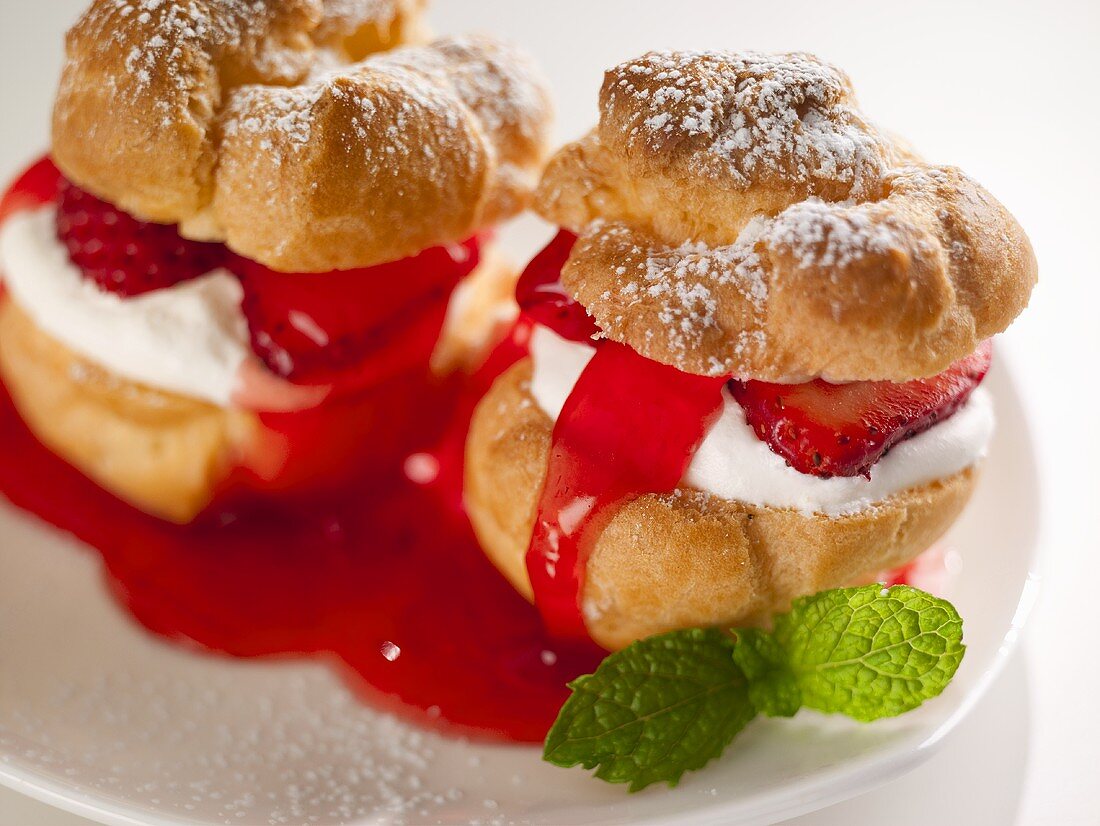 Profiteroles filled with strawberries and cream