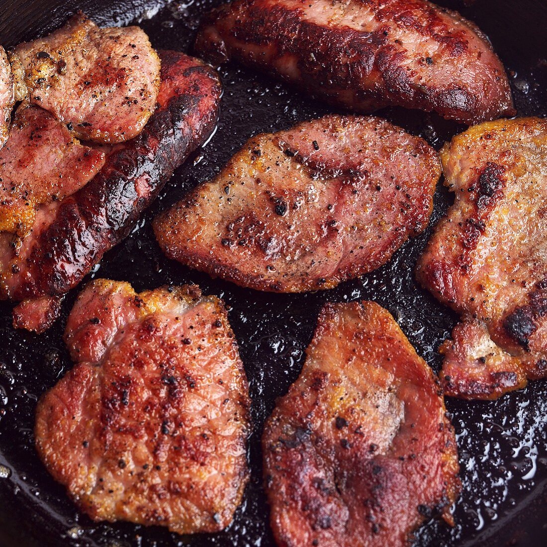 Canadian Bacon Cooking in Skillet