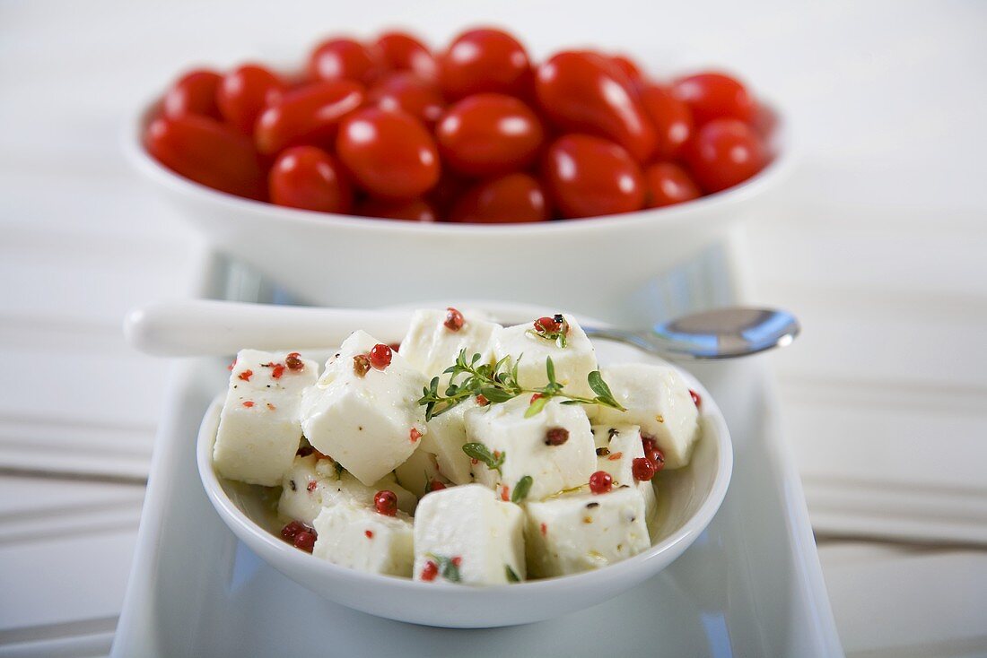 Bowl of Marinated Feta Cheese; Bowl of Tomatoes