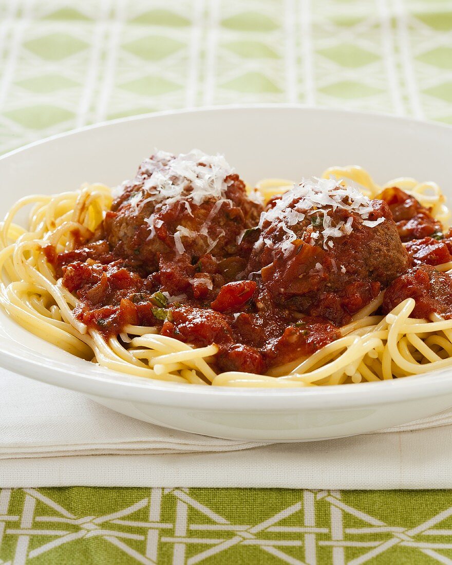 Meatballs Cooked in a Slow Cooker Over Spaghetti