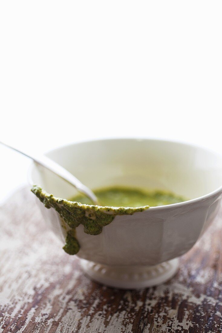 Pesto in a White Bowl; Spilling Over the Side; Spoon