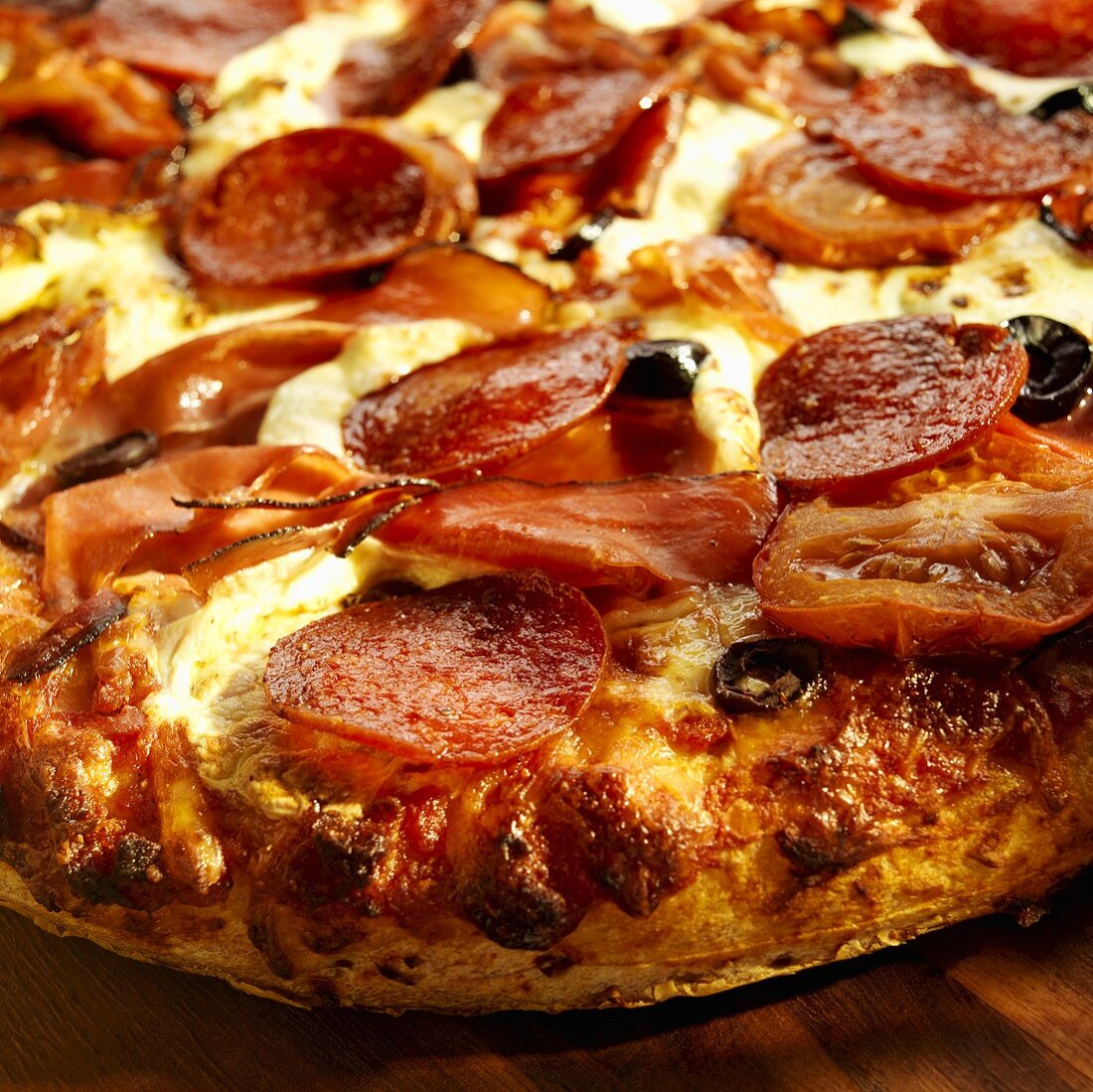 Pizza with Pepperoni, Speck and Olives