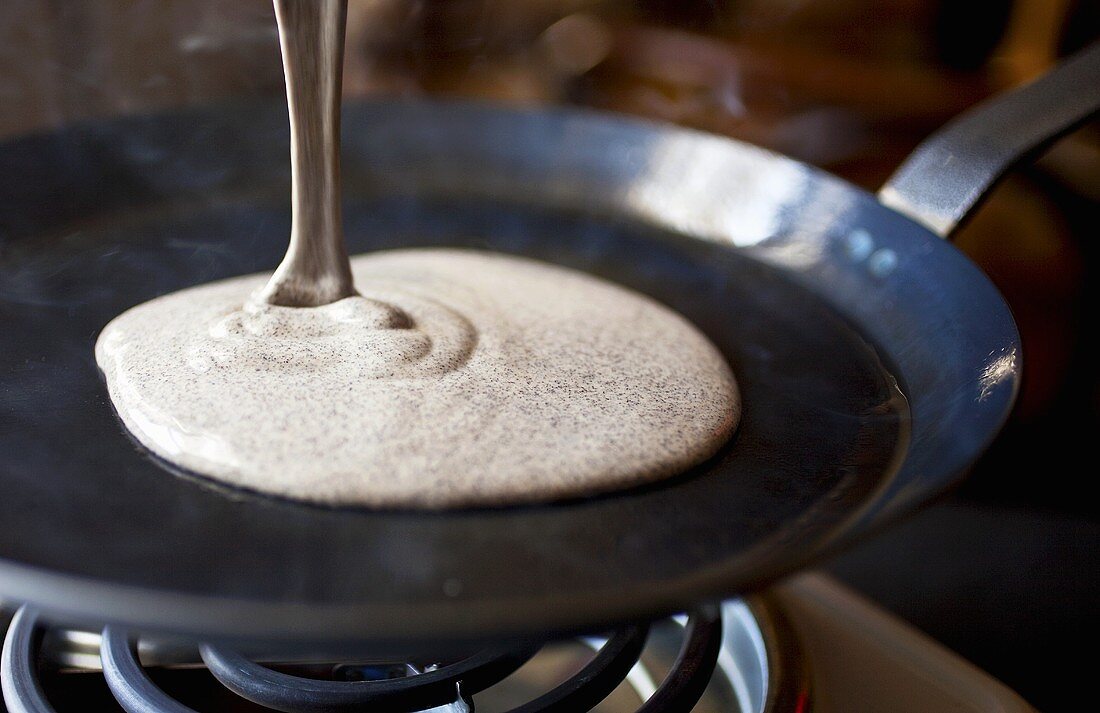 Pouring Buckwheat Crepe Batter onto a Hot Skillet