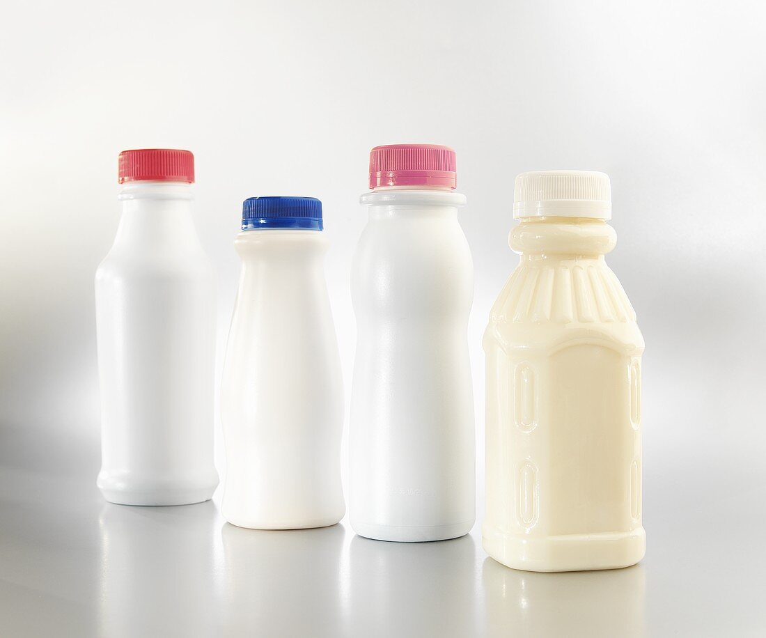 Four Single Serving Plastic Milk Bottles