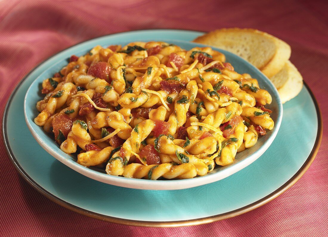 Tomato Gemelli Pasta in a Bowl Bowl; Bread