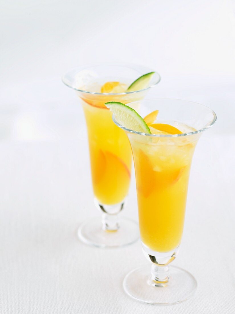 Two Apricot Coolers with Lime Wedge