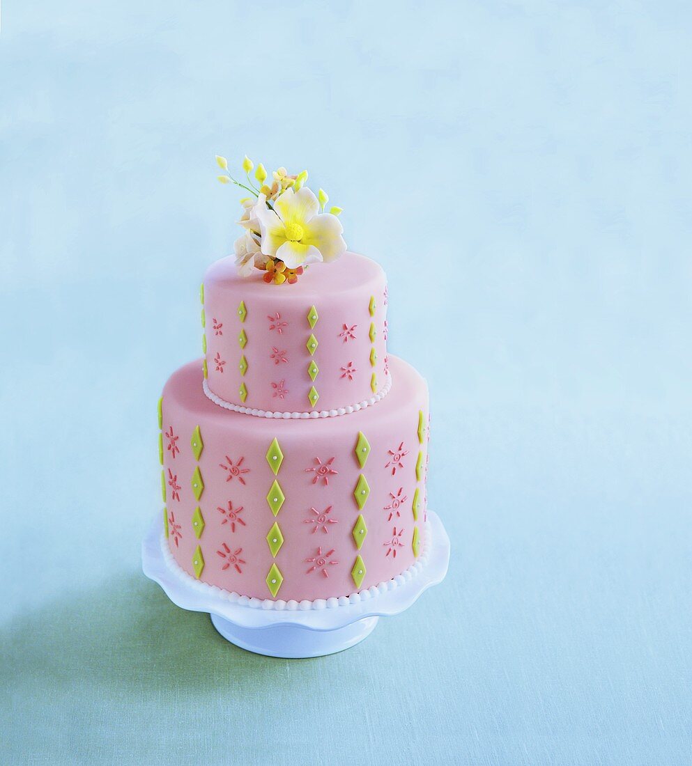 Pink Decorated Cake on Blue Background